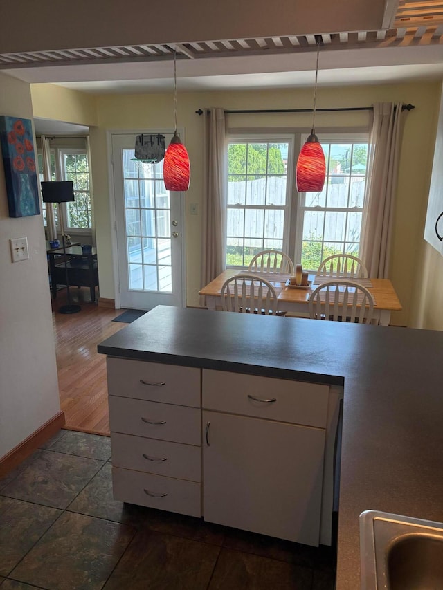 5264 Parkcrest Ln, Columbus, OH 43220 - kitchen with white cabinetry and pendant lighting