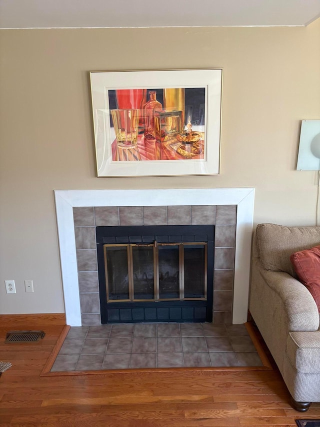 5264 Parkcrest Ln, Columbus, OH 43220 - detailed view of a tiled fireplace and wood finished floors