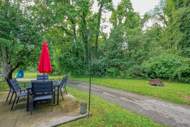1715 Carroll Southern Rd NW, Carroll, OH 43112 - view of grassy yard with a fire pit, a patio, and outdoor dining space