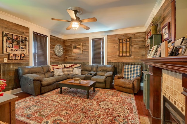 1715 Carroll Southern Rd NW, Carroll, OH 43112 - living room with a fireplace, wooden walls, a ceiling fan, wood finished floors, and ornamental molding
