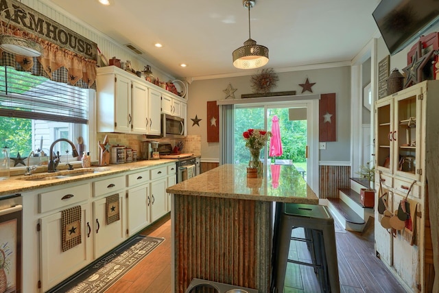 1715 Carroll Southern Rd NW, Carroll, OH 43112 - kitchen featuring crown molding, appliances with stainless steel finishes, plenty of natural light, white cabinetry, and recessed lighting
