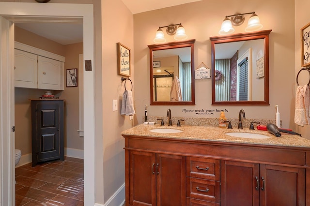 1715 Carroll Southern Rd NW, Carroll, OH 43112 - bathroom with double vanity and wood tiled floors