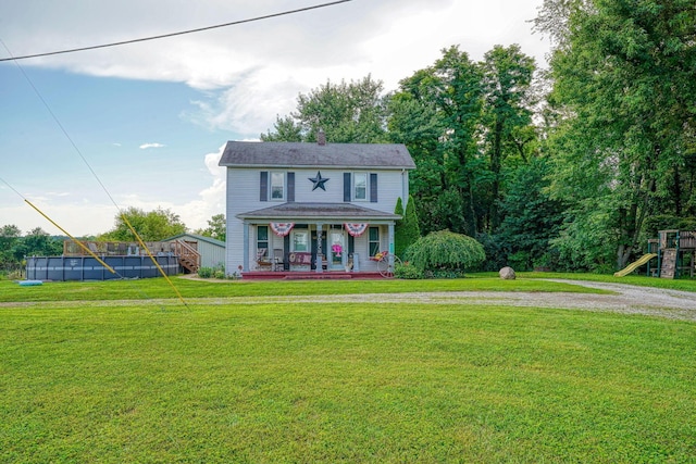 1715 Carroll Southern Rd NW, Carroll, OH 43112 - view of front of home featuring a pool, covered porch, a front yard, a playground, and a chimney