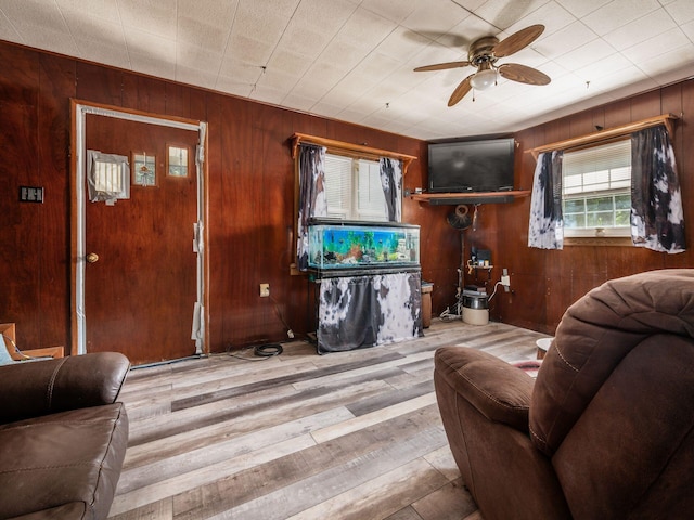 775 Koebel Ave, Columbus, OH 43207 - living room with ceiling fan, wood walls, and wood finished floors
