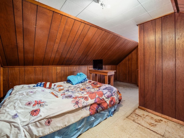 775 Koebel Ave, Columbus, OH 43207 - bedroom with vaulted ceiling, wood walls, and light flooring