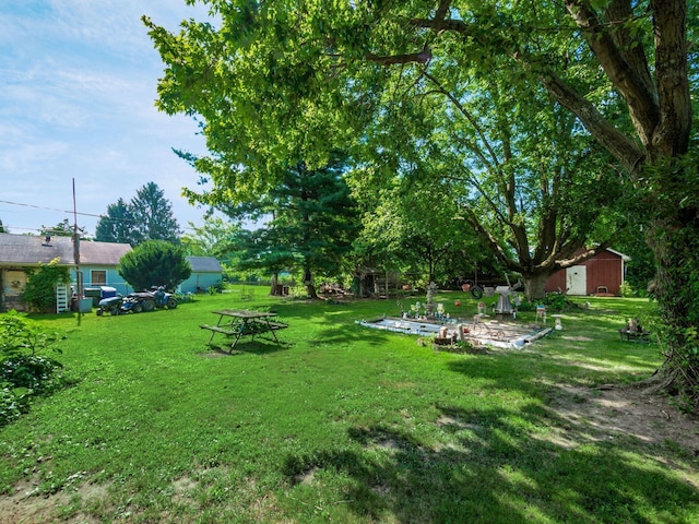 775 Koebel Ave, Columbus, OH 43207 - view of grassy yard featuring a shed and a patio