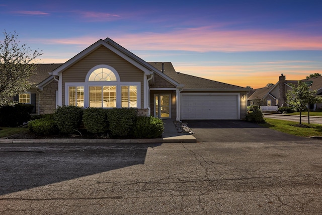 664 Bideford Ave Unit 11B, Blacklick, OH 43004 - single story home with driveway, a garage, and stone siding