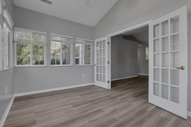 664 Bideford Ave Unit 11B, Blacklick, OH 43004 - empty room with french doors, vaulted ceiling, and wood finished floors