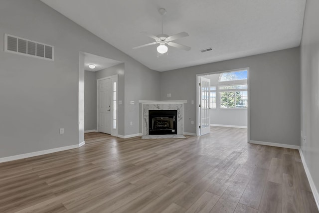 664 Bideford Ave Unit 11B, Blacklick, OH 43004 - unfurnished living room with lofted ceiling, ceiling fan, wood finished floors, and a fireplace