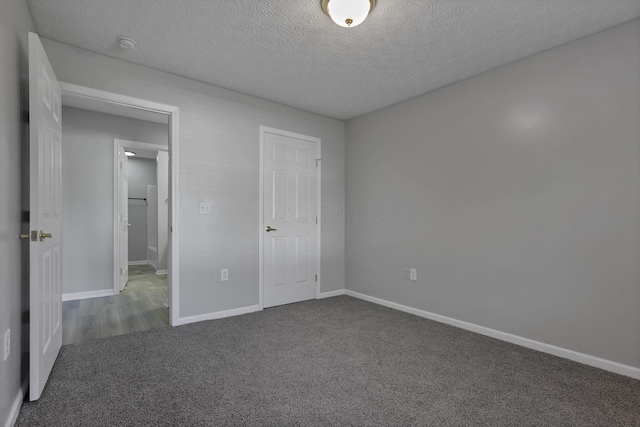 664 Bideford Ave Unit 11B, Blacklick, OH 43004 - unfurnished bedroom featuring carpet flooring and a textured ceiling