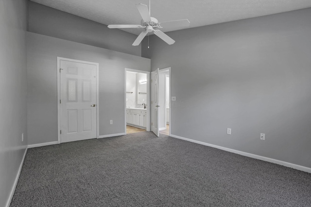 664 Bideford Ave Unit 11B, Blacklick, OH 43004 - unfurnished bedroom featuring carpet floors, ensuite bathroom, ceiling fan, and high vaulted ceiling