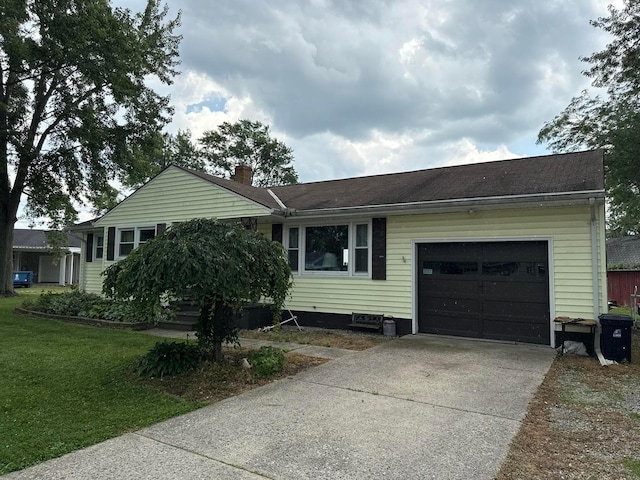 16 Horseshoe Dr, Monroeville, OH 44847 - ranch-style home featuring an attached garage, concrete driveway, a chimney, and a front yard