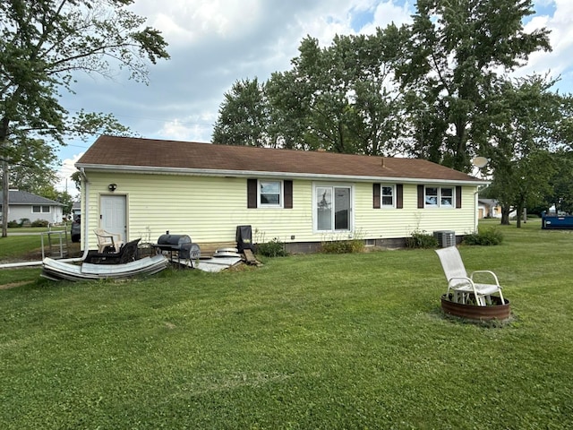 16 Horseshoe Dr, Monroeville, OH 44847 - back of property featuring a lawn and roof with shingles
