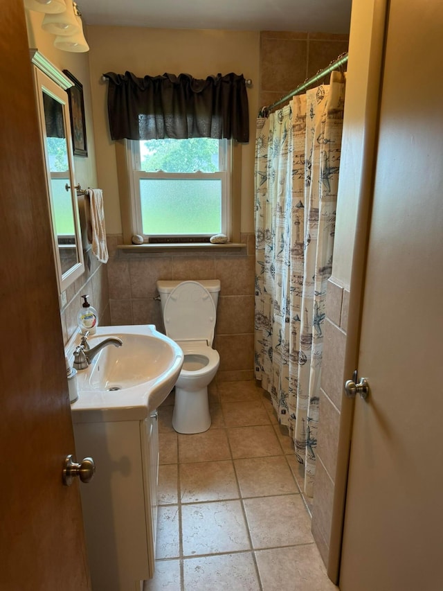 16 Horseshoe Dr, Monroeville, OH 44847 - full bath with vanity, tile walls, tile patterned flooring, curtained shower, and a wainscoted wall