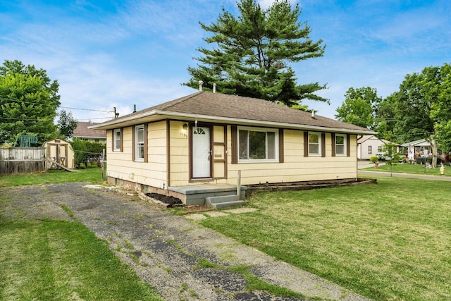 1193 Marble Dr, Columbus, OH 43227 - view of front of property with a storage unit and a shingled roof