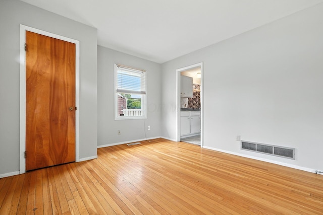 1193 Marble Dr, Columbus, OH 43227 - unfurnished bedroom featuring light wood-type flooring and ensuite bath