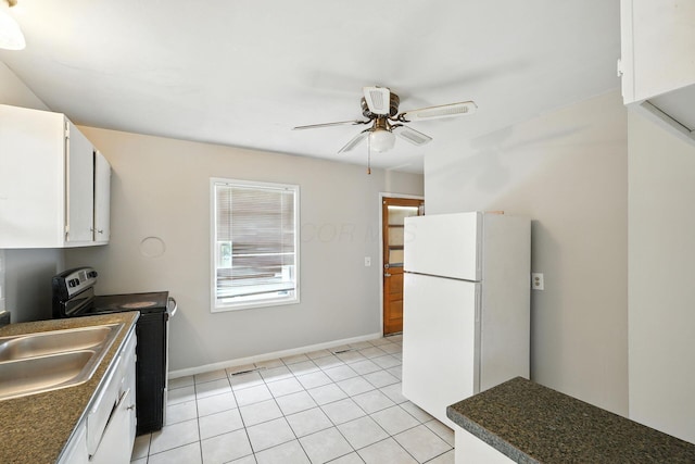 1193 Marble Dr, Columbus, OH 43227 - kitchen featuring freestanding refrigerator, dark countertops, range with electric cooktop, and ceiling fan