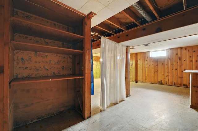 1193 Marble Dr, Columbus, OH 43227 - basement with wood walls and tile patterned floors