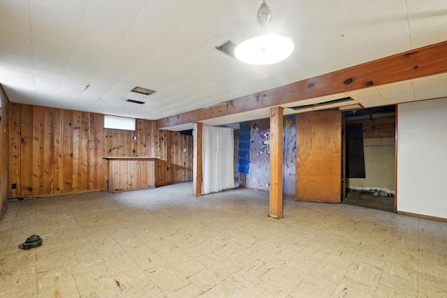 1193 Marble Dr, Columbus, OH 43227 - basement featuring wood walls and tile patterned floors