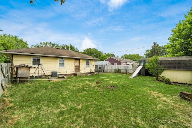 1193 Marble Dr, Columbus, OH 43227 - back of house featuring a fenced backyard, a playground, and a storage shed