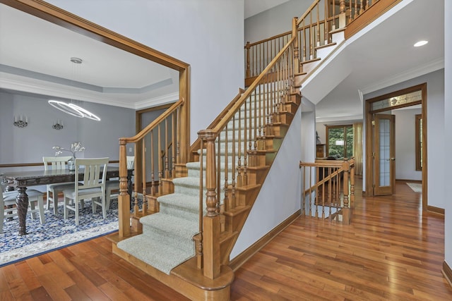 2773 Eleanor Way, Lewis Center, OH 43035 - staircase with hardwood / wood-style flooring, a chandelier, crown molding, and recessed lighting