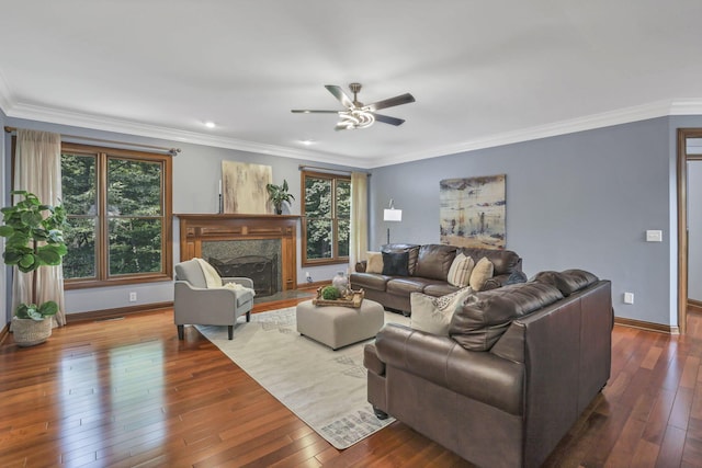 2773 Eleanor Way, Lewis Center, OH 43035 - living area with plenty of natural light, ceiling fan, wood-type flooring, a premium fireplace, and crown molding