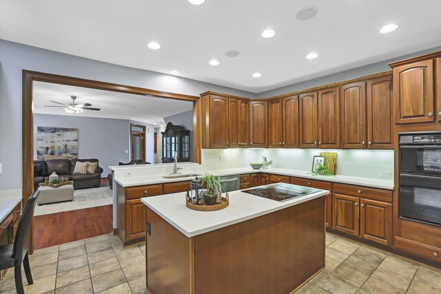 2773 Eleanor Way, Lewis Center, OH 43035 - kitchen featuring black appliances, light countertops, a center island, ceiling fan, and recessed lighting