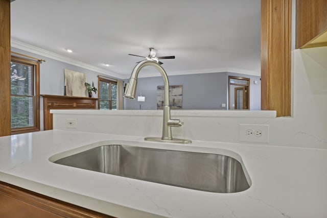 2773 Eleanor Way, Lewis Center, OH 43035 - kitchen view of crown molding, light stone counters, and a ceiling fan