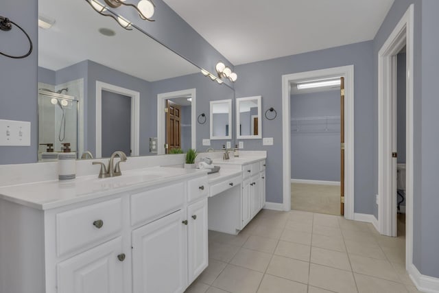 2773 Eleanor Way, Lewis Center, OH 43035 - bathroom with double vanity, a shower stall, a spacious closet, and tile patterned floors