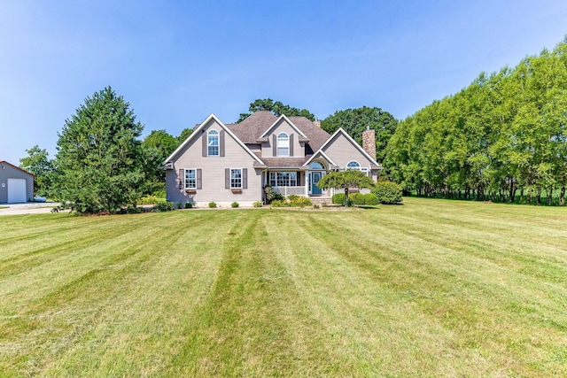 6247 State Route 61, Shelby, OH 44875 - view of front of home with a front lawn and a chimney