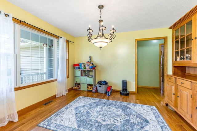 6247 State Route 61, Shelby, OH 44875 - dining area with wood finished floors and a chandelier