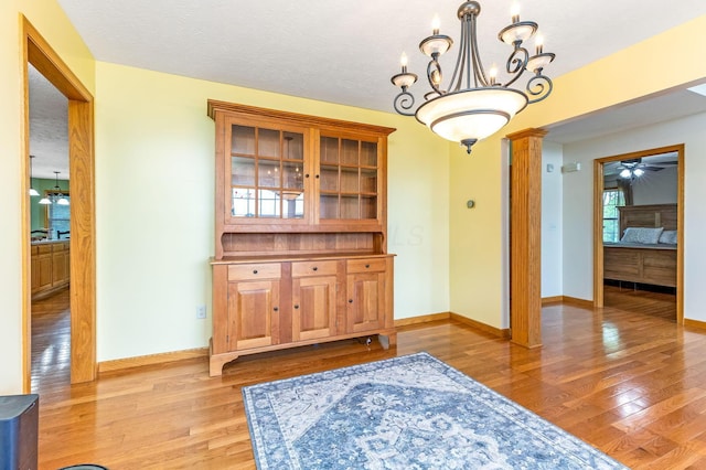 6247 State Route 61, Shelby, OH 44875 - unfurnished dining area with light wood finished floors, ceiling fan, and a chandelier