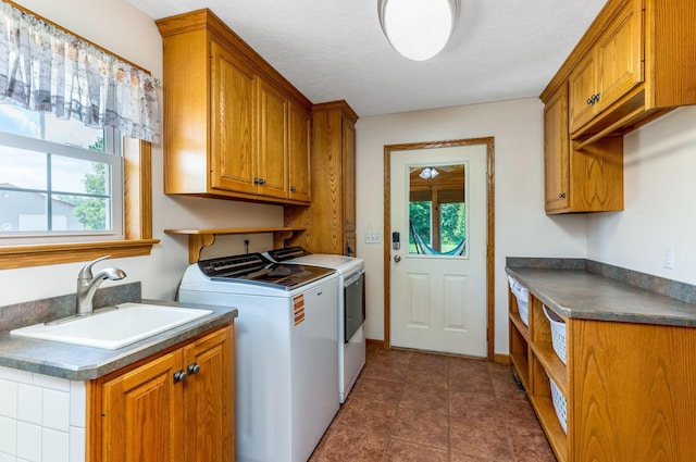 6247 State Route 61, Shelby, OH 44875 - washroom featuring washing machine and dryer, cabinet space, and healthy amount of natural light