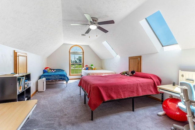 6247 State Route 61, Shelby, OH 44875 - carpeted bedroom featuring a skylight, vaulted ceiling, a textured ceiling, and ceiling fan