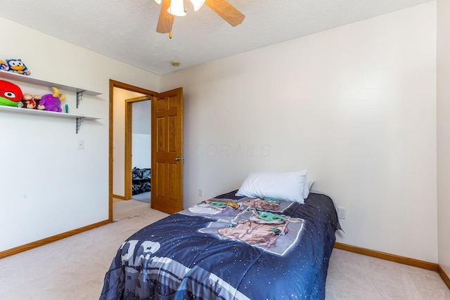 6247 State Route 61, Shelby, OH 44875 - carpeted bedroom featuring ceiling fan and a textured ceiling