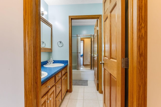 6247 State Route 61, Shelby, OH 44875 - full bath with double vanity, tile patterned flooring, and combined bath / shower with glass door