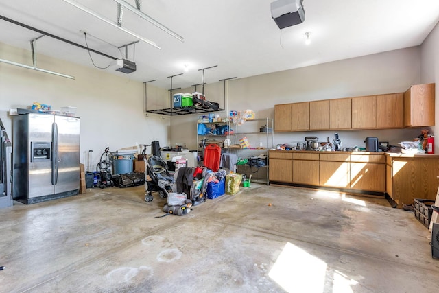 6247 State Route 61, Shelby, OH 44875 - garage with stainless steel fridge and a garage door opener