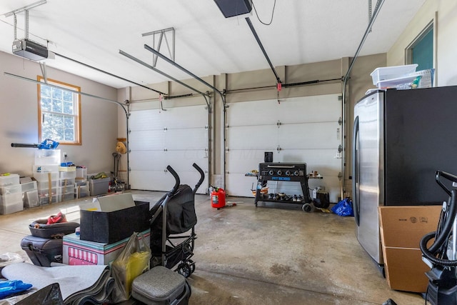 6247 State Route 61, Shelby, OH 44875 - garage featuring freestanding refrigerator and a garage door opener