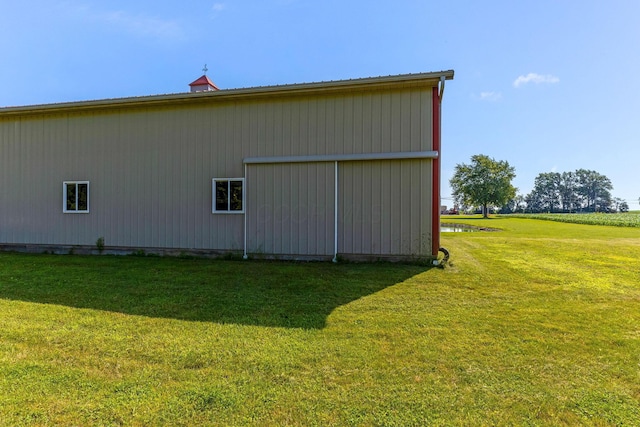 6247 State Route 61, Shelby, OH 44875 - view of property exterior featuring a pole building, a lawn, and an outdoor structure