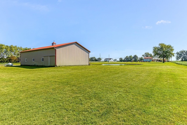 6247 State Route 61, Shelby, OH 44875 - view of green lawn with an outbuilding and a water view