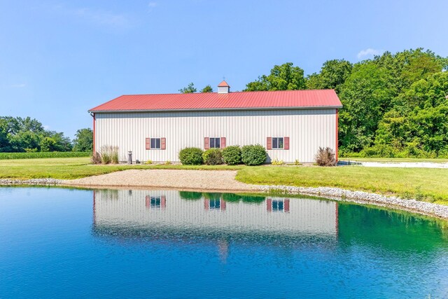 6247 State Route 61, Shelby, OH 44875 - view of pool with a lawn, a water view, a pole building, and an outbuilding