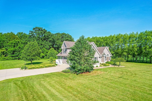 6247 State Route 61, Shelby, OH 44875 - view of front of home with a front lawn and a view of trees