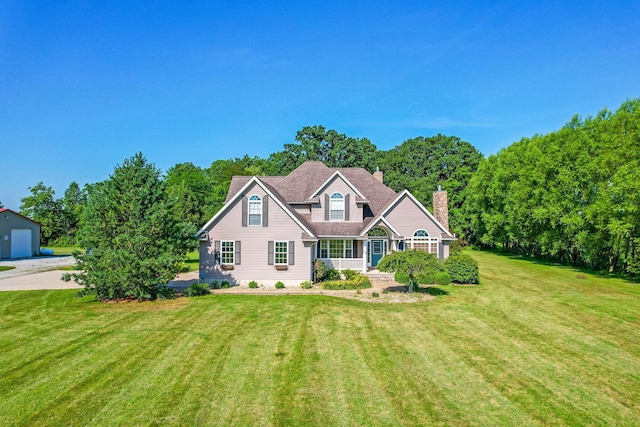 6247 State Route 61, Shelby, OH 44875 - view of front of property with a front lawn and a chimney
