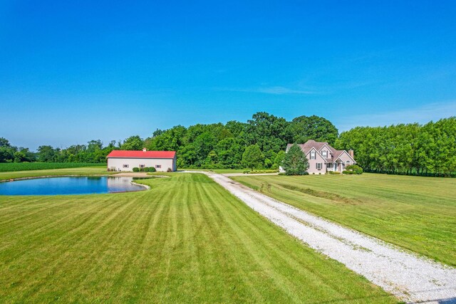 6247 State Route 61, Shelby, OH 44875 - view of grassy yard featuring driveway and a water view