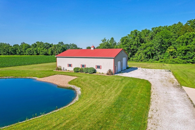 6247 State Route 61, Shelby, OH 44875 - view of swimming pool featuring an outbuilding, a lawn, a water view, and a pole building
