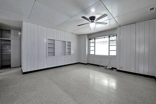 141 Dunmore Rd, Circleville, OH 43113 - spare room featuring ceiling fan and wood walls