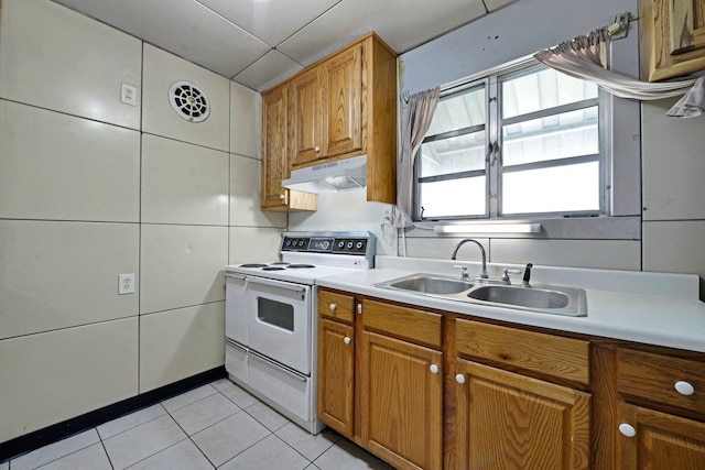 141 Dunmore Rd, Circleville, OH 43113 - kitchen featuring white electric range, under cabinet range hood, light countertops, and light tile patterned floors