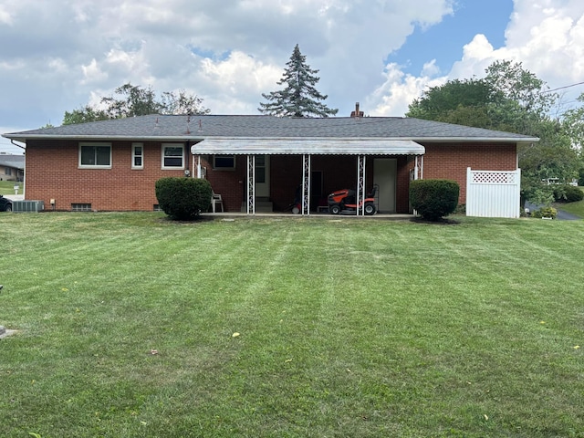 3281 Darracq Cir, Columbus, OH 43223 - rear view of house featuring brick siding, a lawn, and a patio