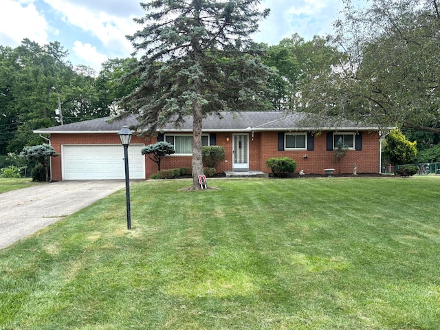 3281 Darracq Cir, Columbus, OH 43223 - ranch-style home with brick siding, a garage, driveway, and a front yard