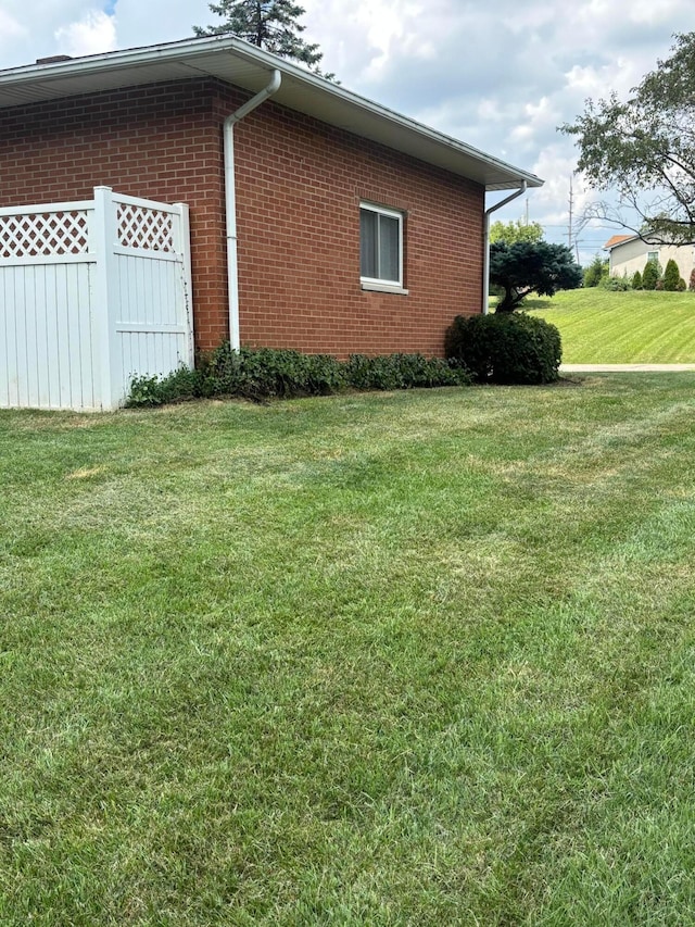 3281 Darracq Cir, Columbus, OH 43223 - view of side of home with brick siding and a lawn